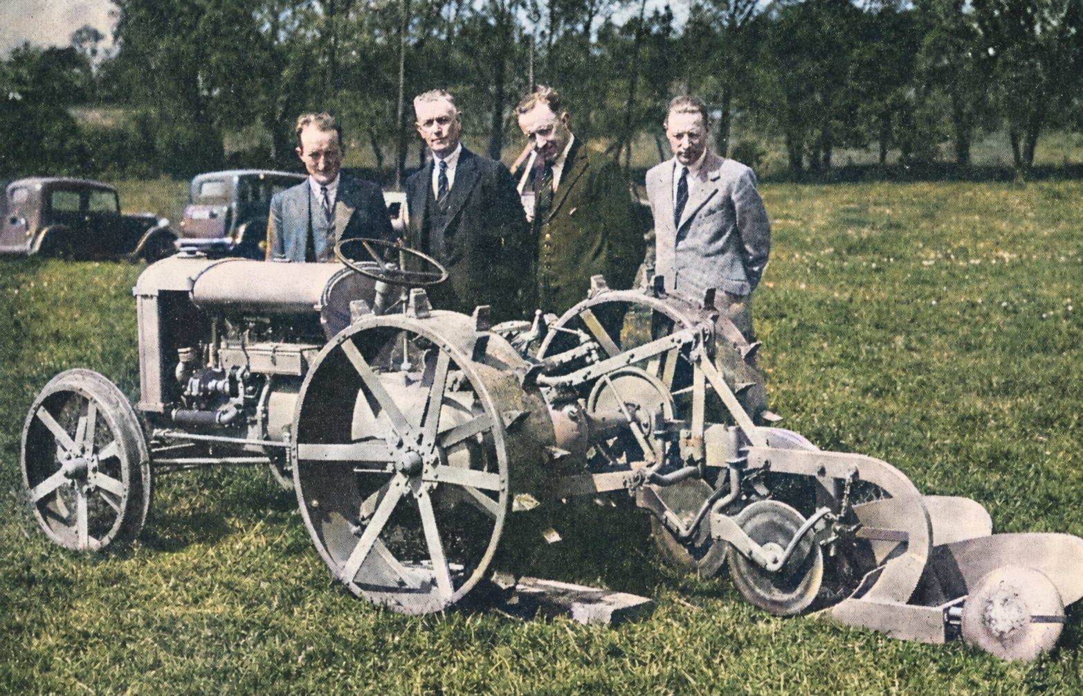 William J. Sands, second from right, with Harry Ferguson and engineering colleagues beside an experimental tractor